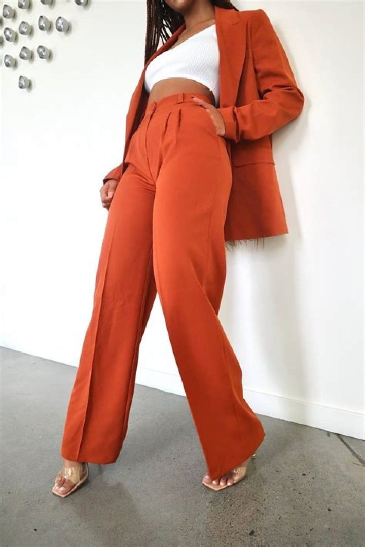 Alessandra Ambrosio Stuns In Plunging Bikini Top & High-Waisted Orange Pants While Out In LA