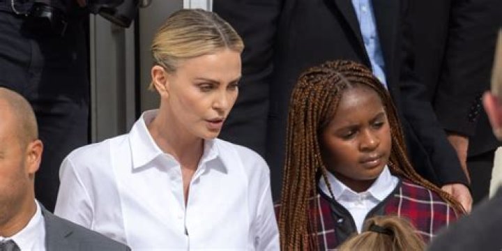 Charlize Theron Snuggles 1 Of her Daughters In Rare Photo As She Gears Up For 2022