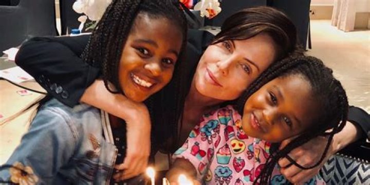 Charlize Theron Shares Rare Photo Of Daughters, 7 & 10, In Birthday Tribute For Her Mom