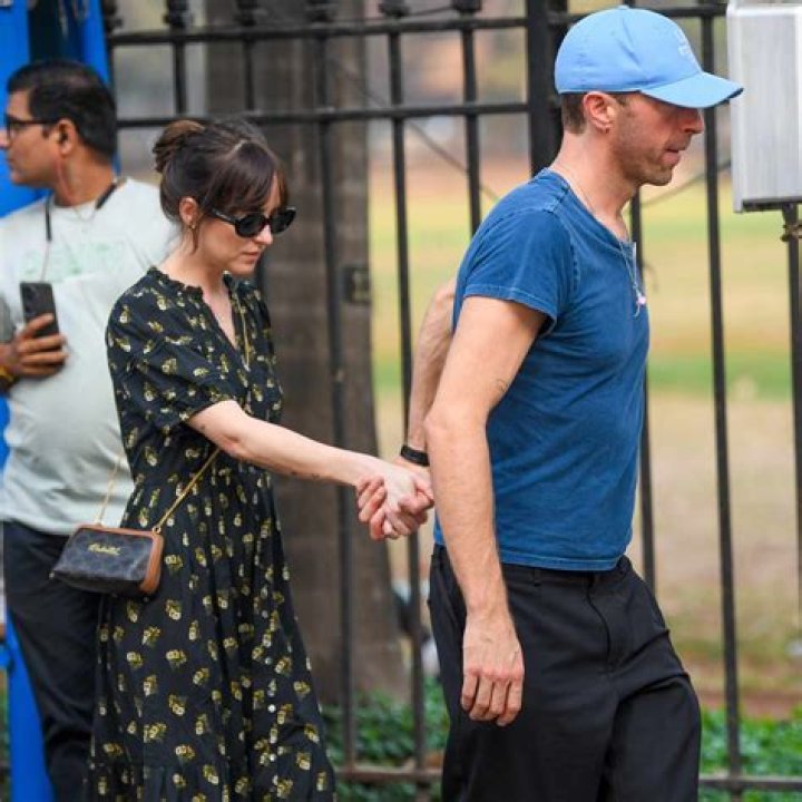 Chris Martin Wraps Arm Around Son Moses, 13 With Girlfriend Dakota Johnson As They Head To Movies