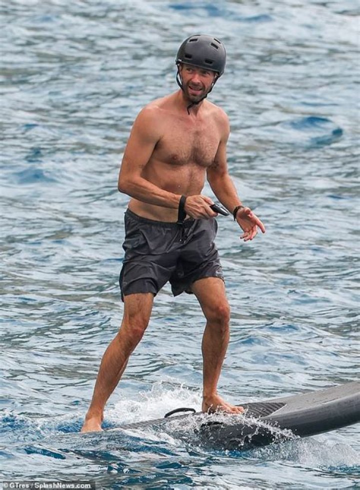 Chris Martin Goes Shirtless As He Surfs With Son Moses, 17, In Ibiza: Photos
