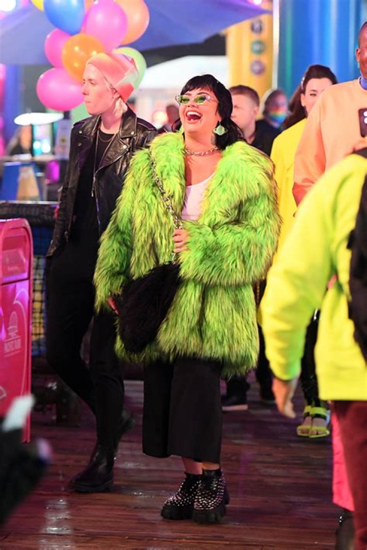 Demi Lovato Wears Green Fur Jacket To Paris Hilton’s Wedding Carnival – Hollywood Life
