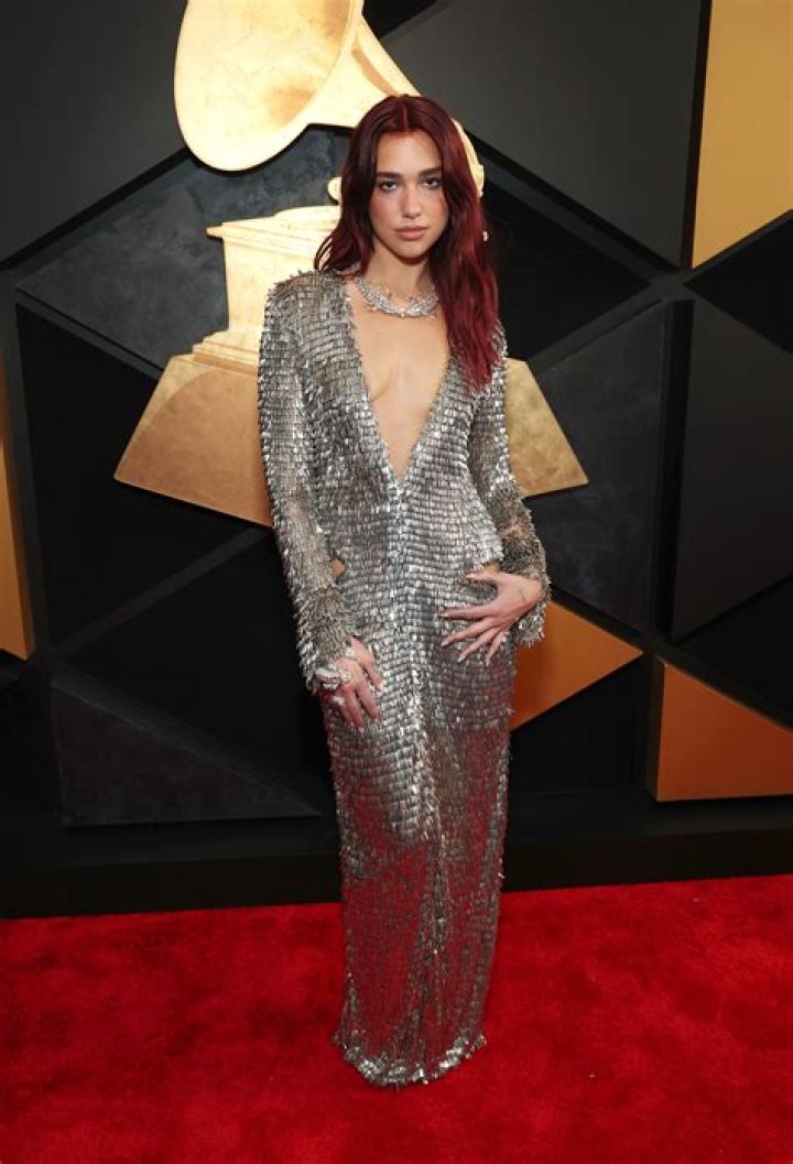 Dua Lipa Dazzles in Silver Metal Plunging V-Neck Gown at the 2024 Grammys: Photos