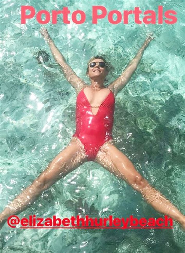 Elizabeth Hurley’s Red Bathing Suit — Cleavage In Pool Pic – Hollywood Life