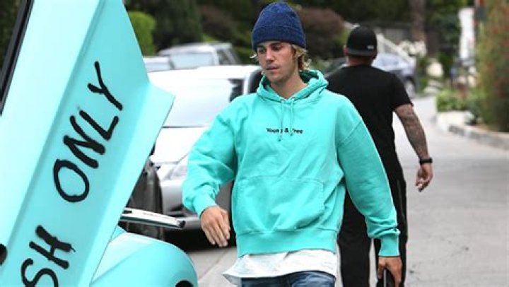 Justin Bieber Matches His Sweatshirt With His Lamborghini & Fans Love It