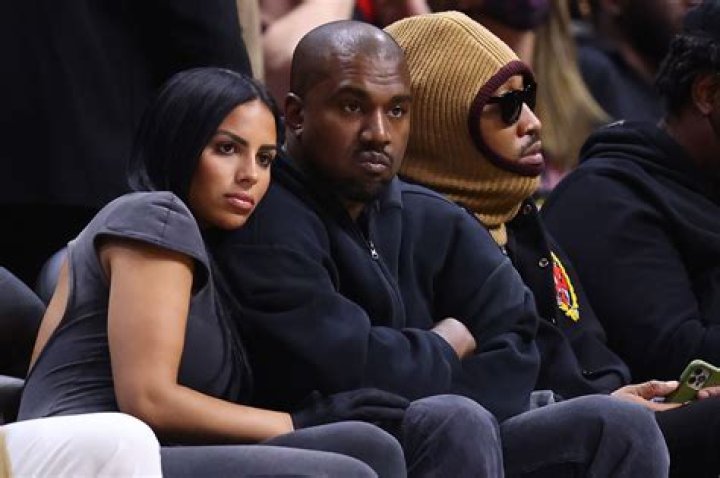 Kanye West Covers Face For Flight With Chaney Jones After He Challenges Kim’s ‘Legally Single’ Request