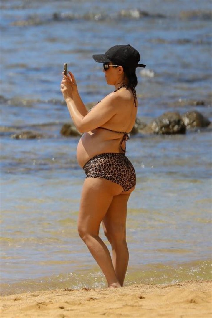Kourtney Kardashian Wears Bikini Top As She Twins With Penelope, 9, In Blue Bucket Hats — Photo