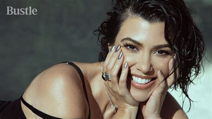 Kourtney Kardashian Rocks Sexy Sheer Black Dress & Shows Off Engagement Ring For ‘Bustle’