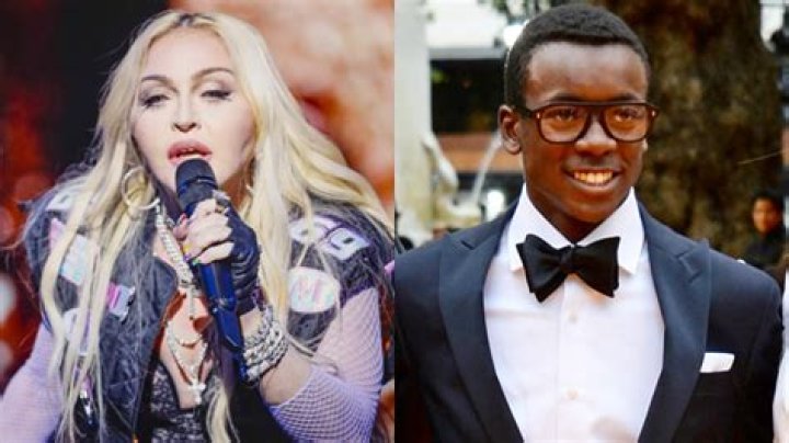 Madonna’s Son David Banda, 17, Wraps An Arm Around Her As They Arrive In NYC After Her Health Scare