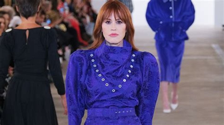 Molly Ringwald Gives ‘80s Throwback Vibes in Purple Dress as She Walks the Runway at NYFW