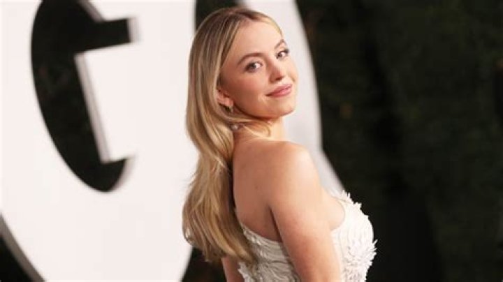 Sydney Sweeney Wears Nothing But An Off-The-Shoulder Robe In Gorgeous Photo